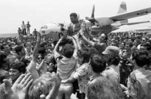 Rescue Pilot Lifted on Shoulders